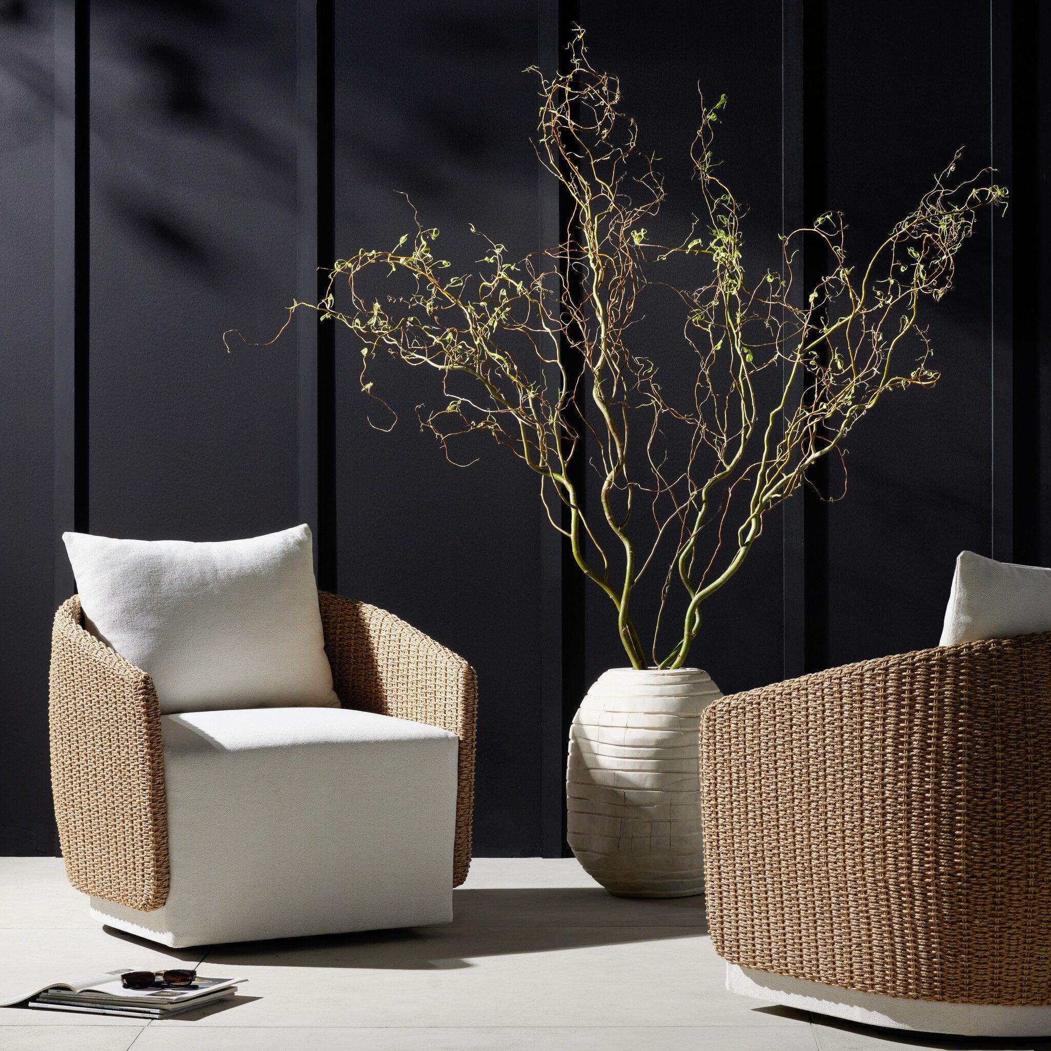 Outdoor Hospitality setting Maven Outdoor Swivel Chair in Alessi Linen with a faux hyacinth woven shell and 360-degree base