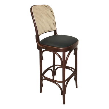 Theo bar stool with beige woven back, round dark seat, and curved dark wood base