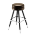 Brown upholstered bar stool with round seat, chrome footrest, dark tapered legs