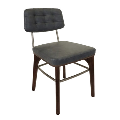 Dark gray upholstered side chair with tufted back and metal base