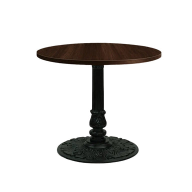 Round wooden table with decorative metal base on a plain background