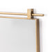 Right corner detail Chico small square wall mirror with a vertical antique brass suspension bar