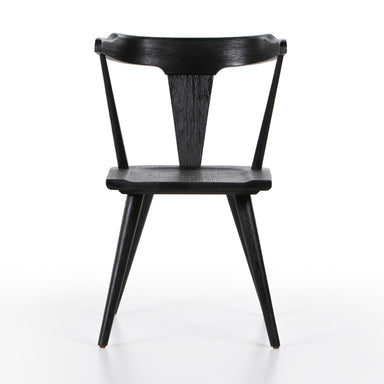 A black dining chair with a mid-century Windsor design, featuring a bow-shaped backrest and wooden legs. Ripley Dining Chair in Black Oak with mid-century Windsor-style sculptural silhouette.