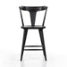 Black oak counter stool with curved back and vertical slatted frame, built-in footrest