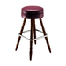 Rouge upholstered bar stool with dark brown turned legs and chrome footrest