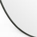 Rounded bottom corner detail Bellvue round mirror with a classic black iron frame hanging 
