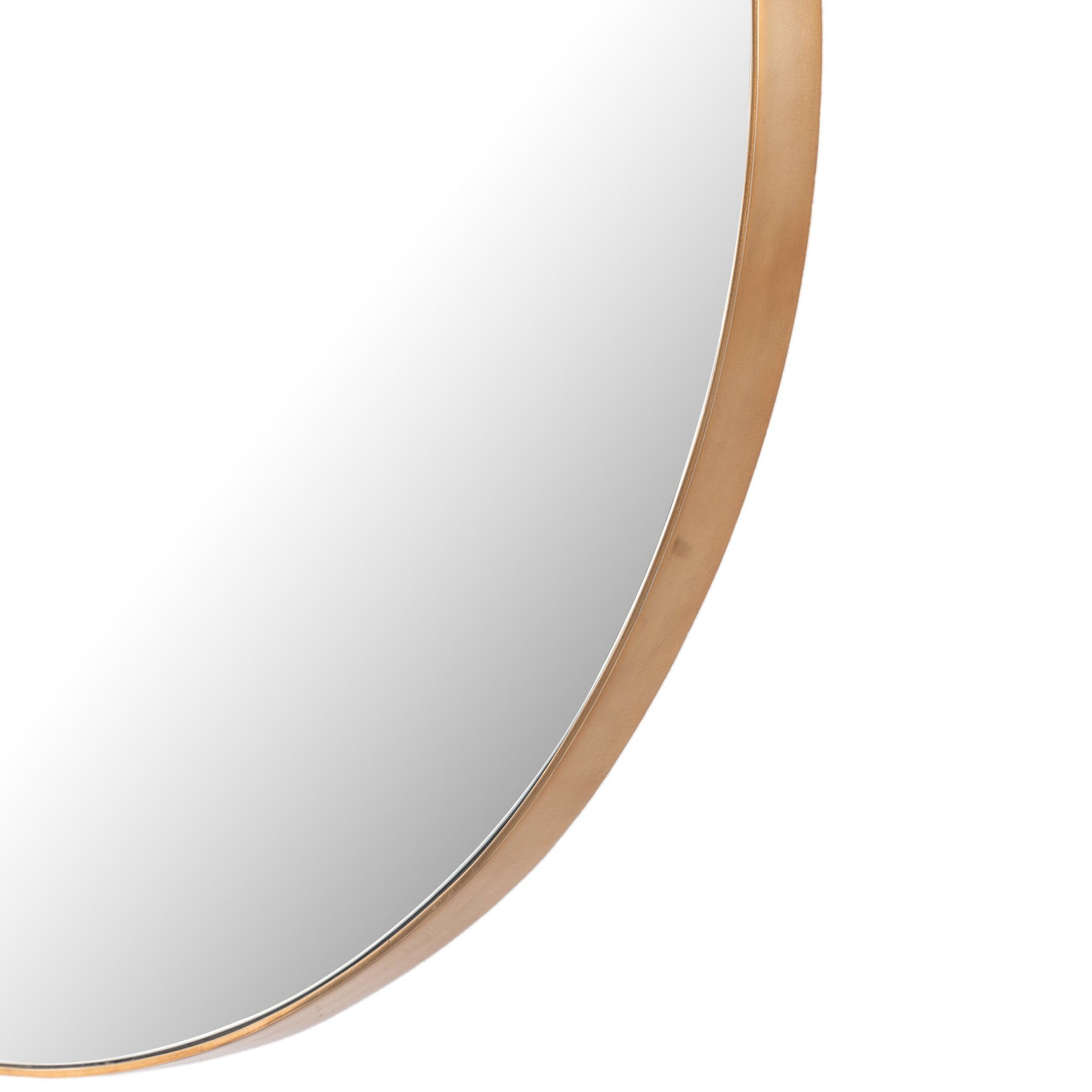 Rounded close-up of the Georgina mirror's slender polished brass frame showing the refined modern edge