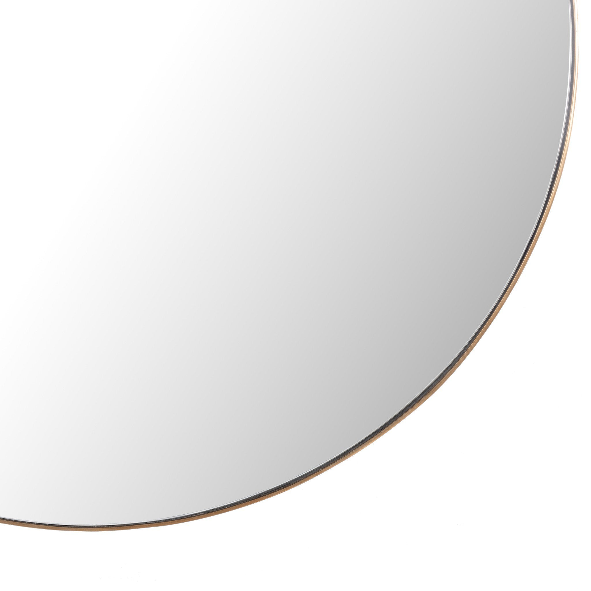 Rounded sleek edge close-up of the Georgina mirror's slender polished brass frame showing the refined modern edge and spacious mirror finish