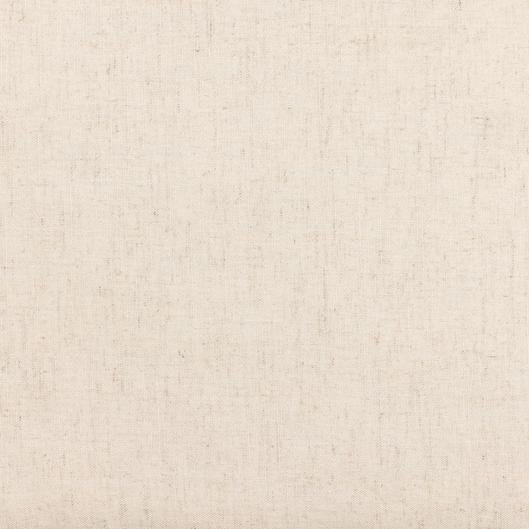 Cream upholstery fabric surface with fine woven texture