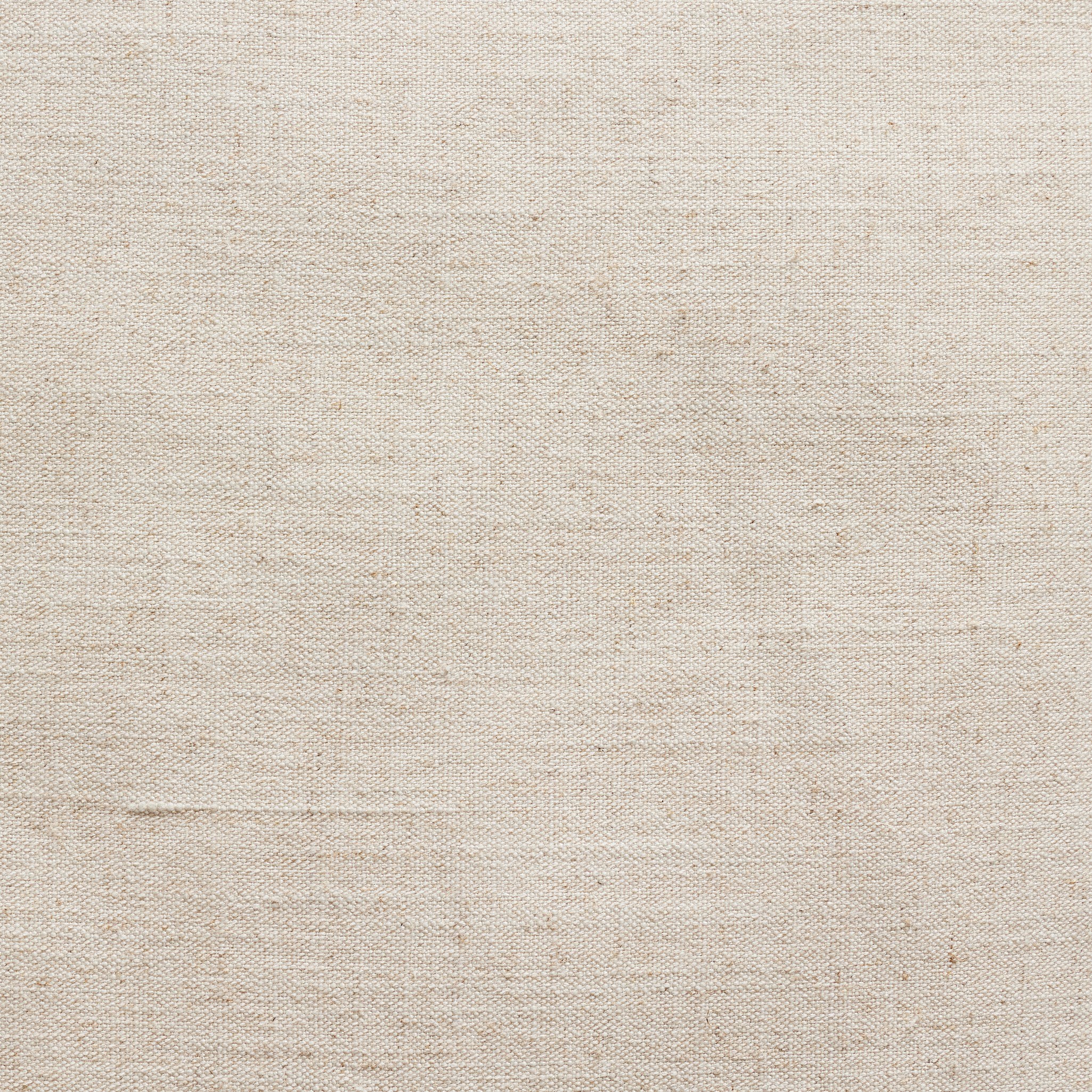 Cream woven fabric seat cushion close-up