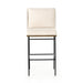 Bar stool with light linen-look cushion, black metal frame and footrest