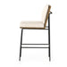 Bar stool with light cushion and backrest, black frame and angled seat profile