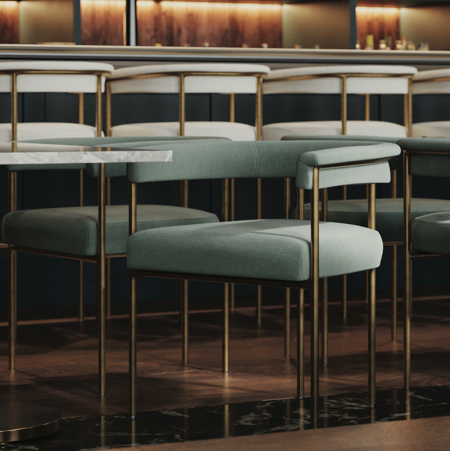 Teal fabric arm chair with padded arms, upholstered seat, and gold metal frame