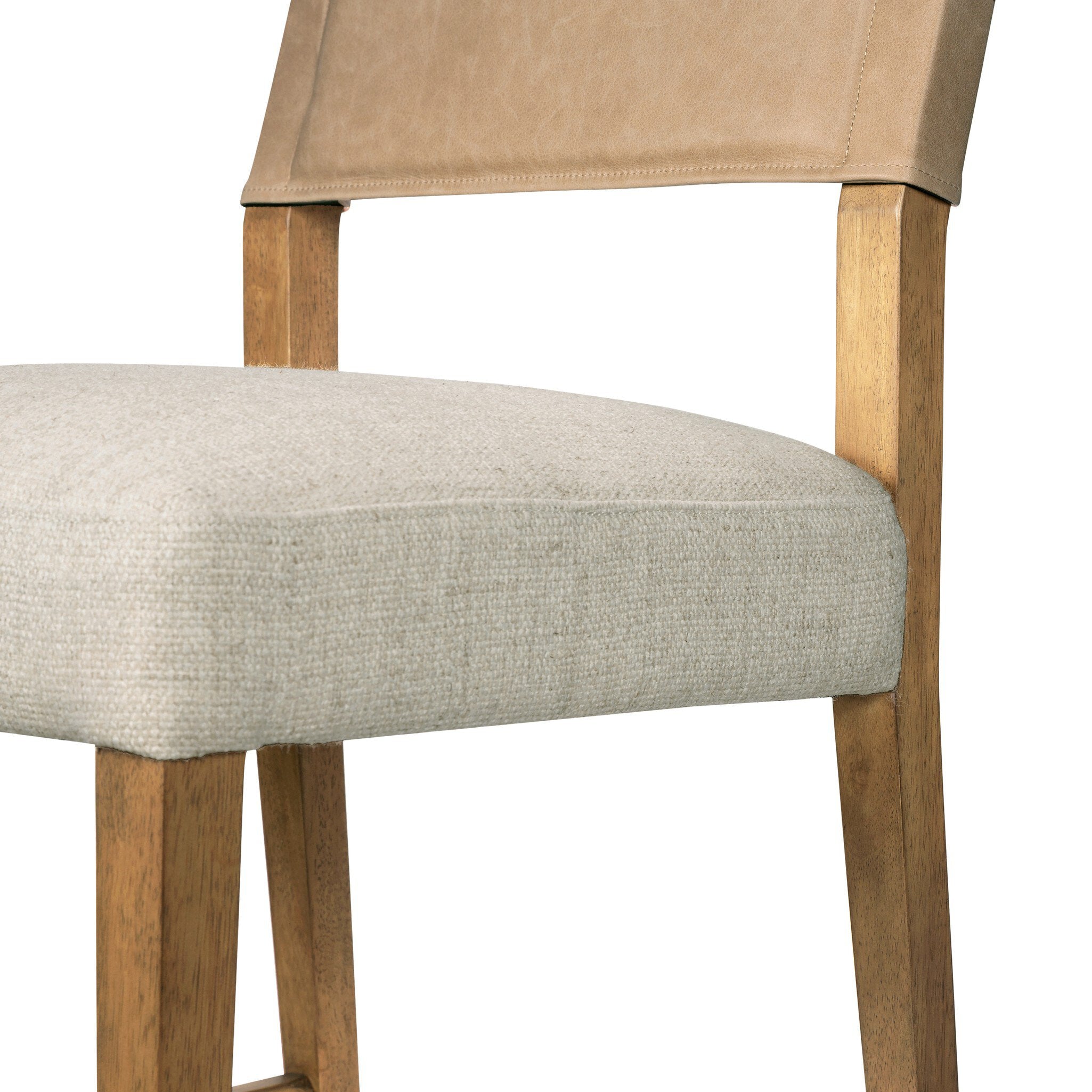 Cream upholstered seat and wooden legs on tan leather-look counter stool