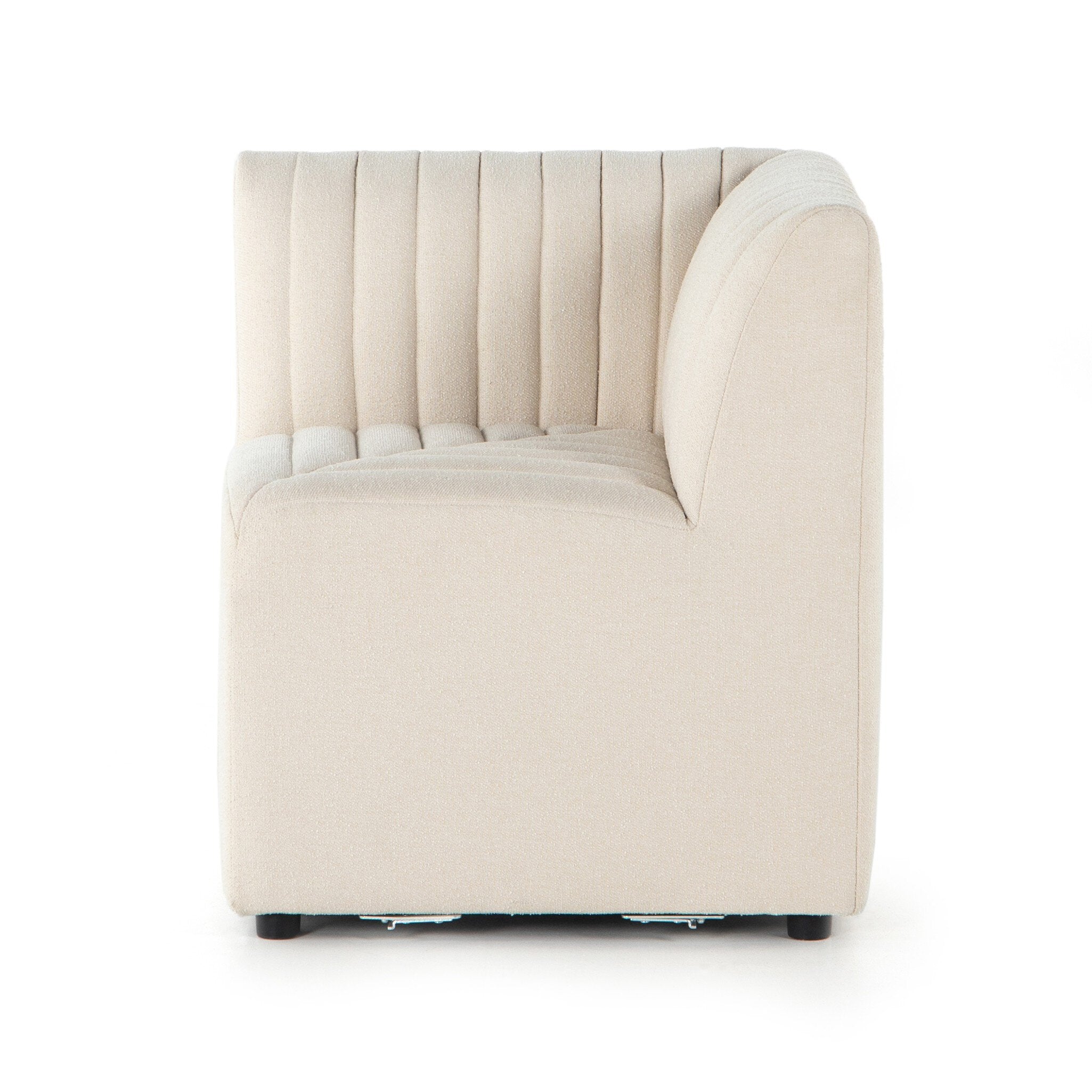 Side Corner Detail Custom Augustine dining banquette in neutral performance fabric with high-back tufted detailing and wood base.