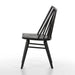 Black armless dining chair side view with slatted back, smooth dark wood seat, tapered legs