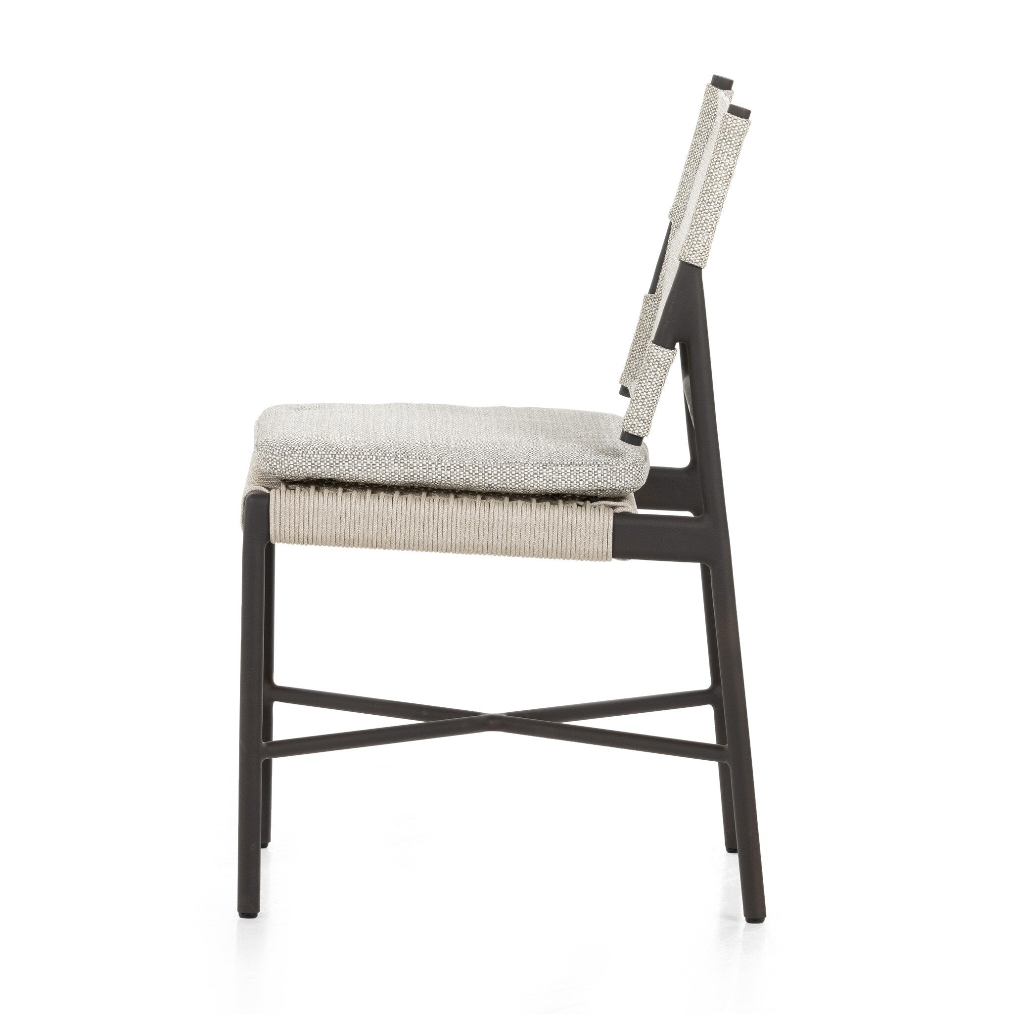 Side Miller outdoor performance dining chair with a light taupe fabric cushion, wrap detail, and a crossed bronze aluminum frame.
