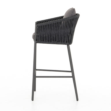 Side Porto Outdoor Bar Stool with a natural teak frame and weather-resistant grey rope-weave backrest