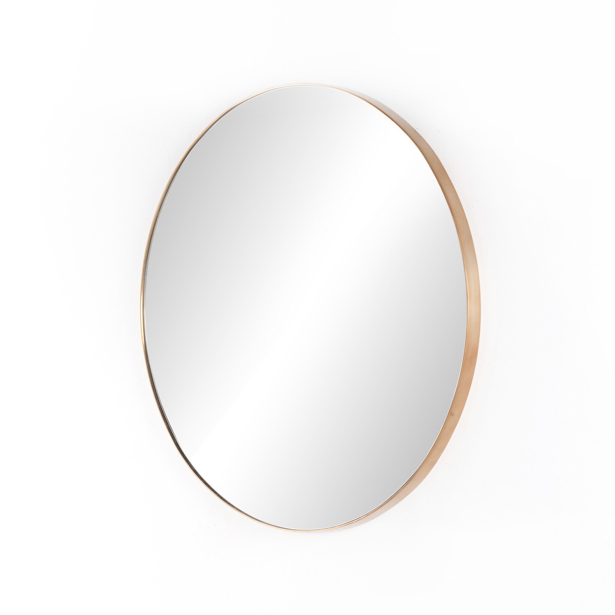Side detail of Georgina mirror's slender polished brass frame showing the refined modern edge