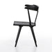 Black wooden chair on a white background. Side view Ripley Dining Chair in Black Oak with mid-century Windsor-style sculptural silhouette.