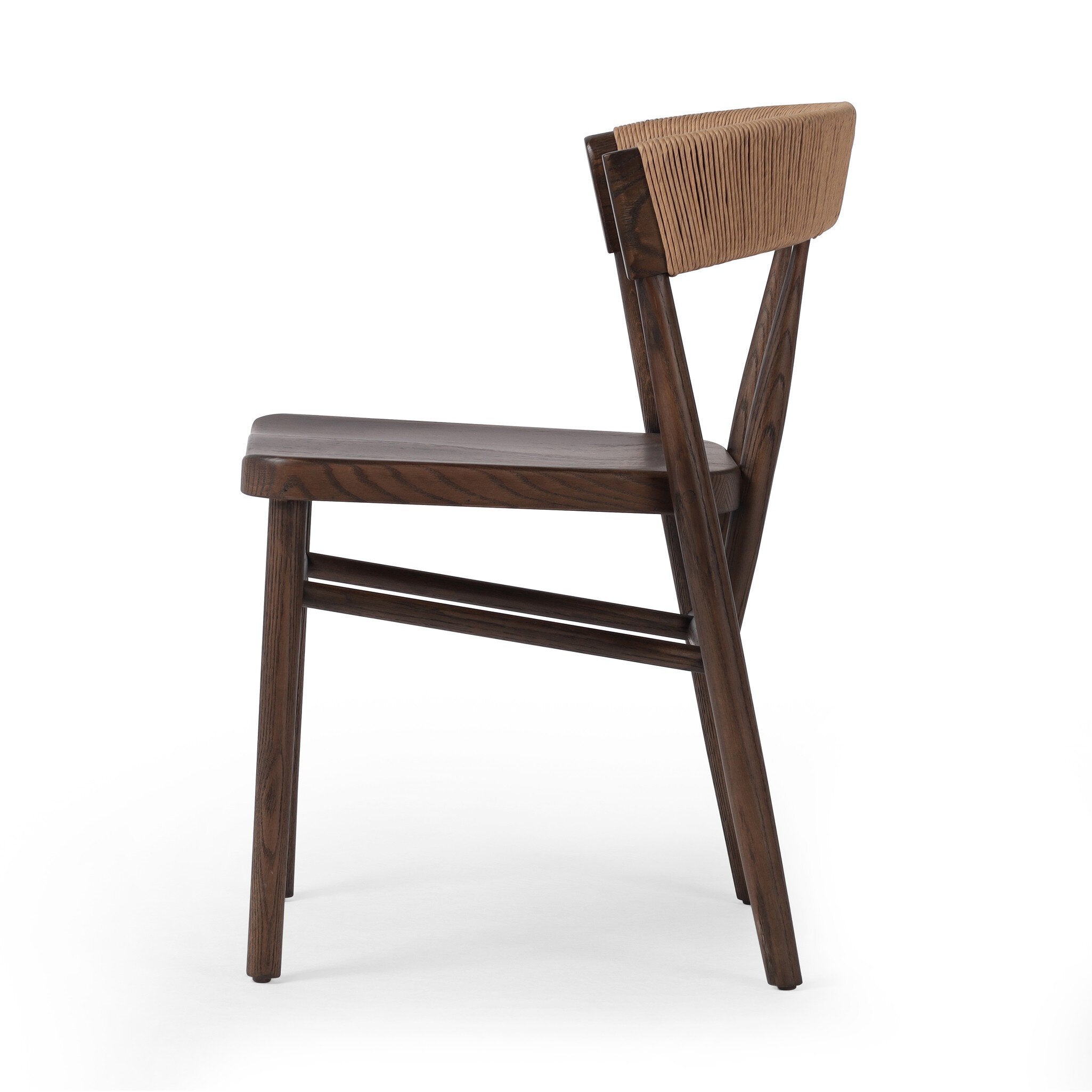 Side view A solid oak dining chair with a paper rush wrapped detail on the back, tapered legs, and a dark finish.