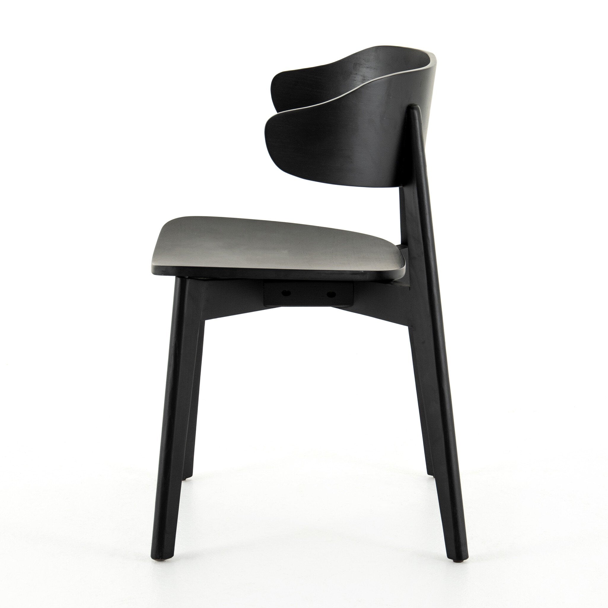 Black armless dining chair with curved backrest, round seat, and angled legs