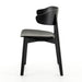 Black armless dining chair with curved backrest, round seat, and angled legs