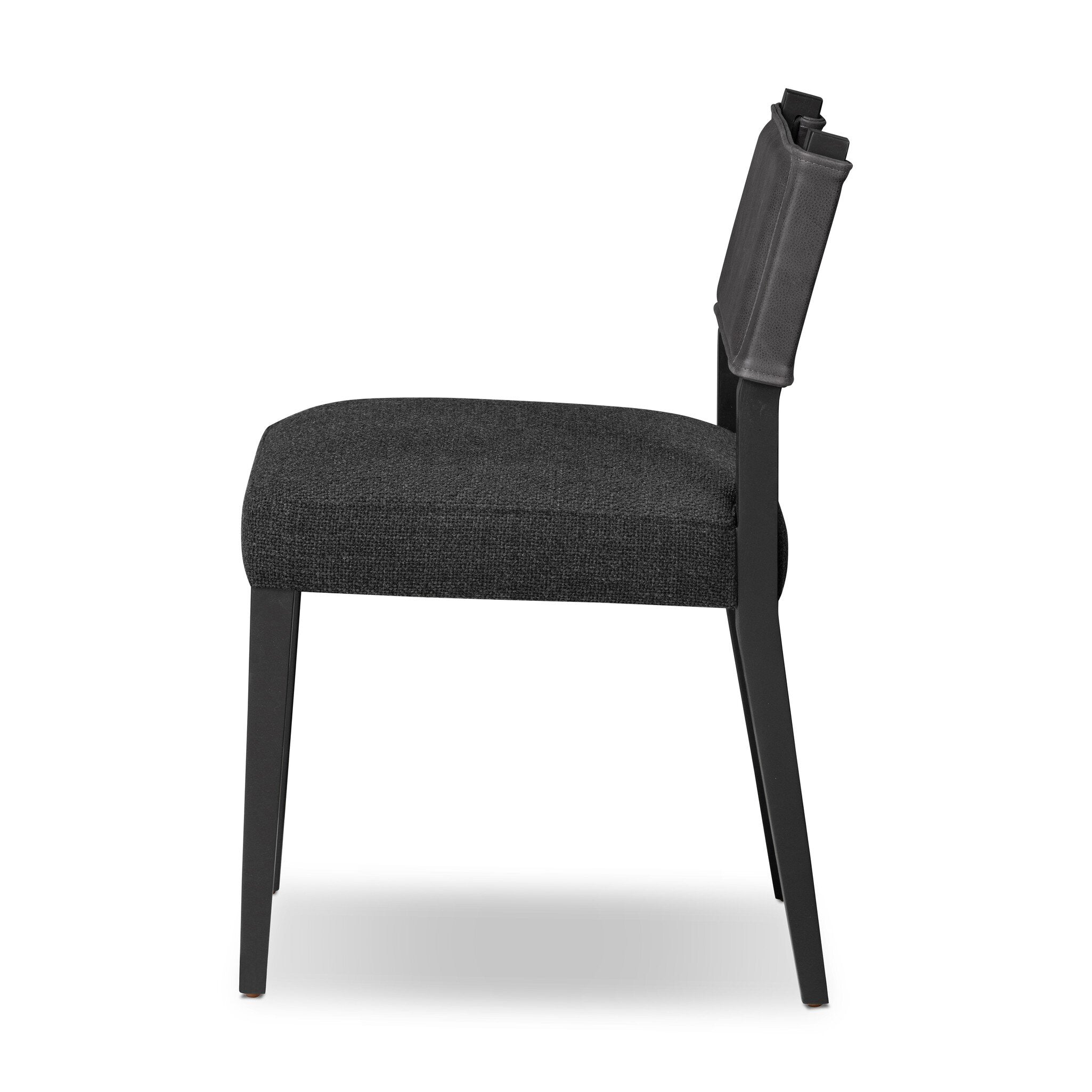 Armless dining chair with gray upholstered seat and dark backrest, front three-quarter view