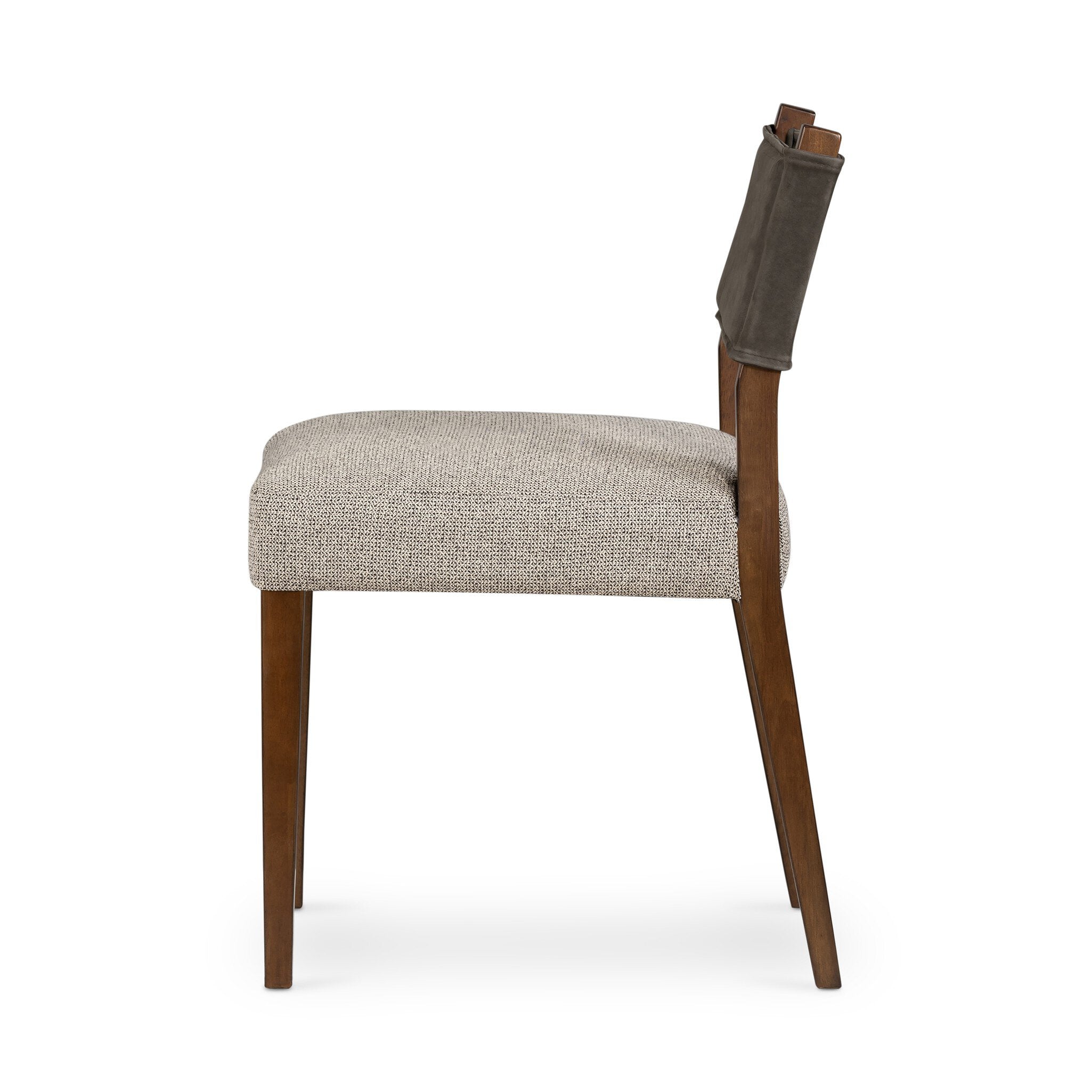 Armless dining chair with beige upholstered seat and dark fabric back, wood legs
