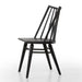Black armless dining chair angled view with slatted back and dark wood seat, curved rails