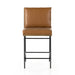 Counter stool with tan leather-look padded seat and tall back, black metal frame