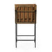 Counter stool with tan upholstered seat, wooden back slats, and black metal base