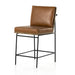Counter stool with brown leather-look seat cushion and tall back, black metal legs
