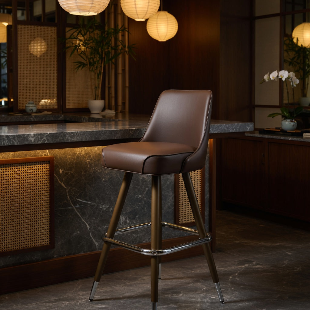 Brown leather bar stool with padded seat and back; straight wood legs and chrome footrest