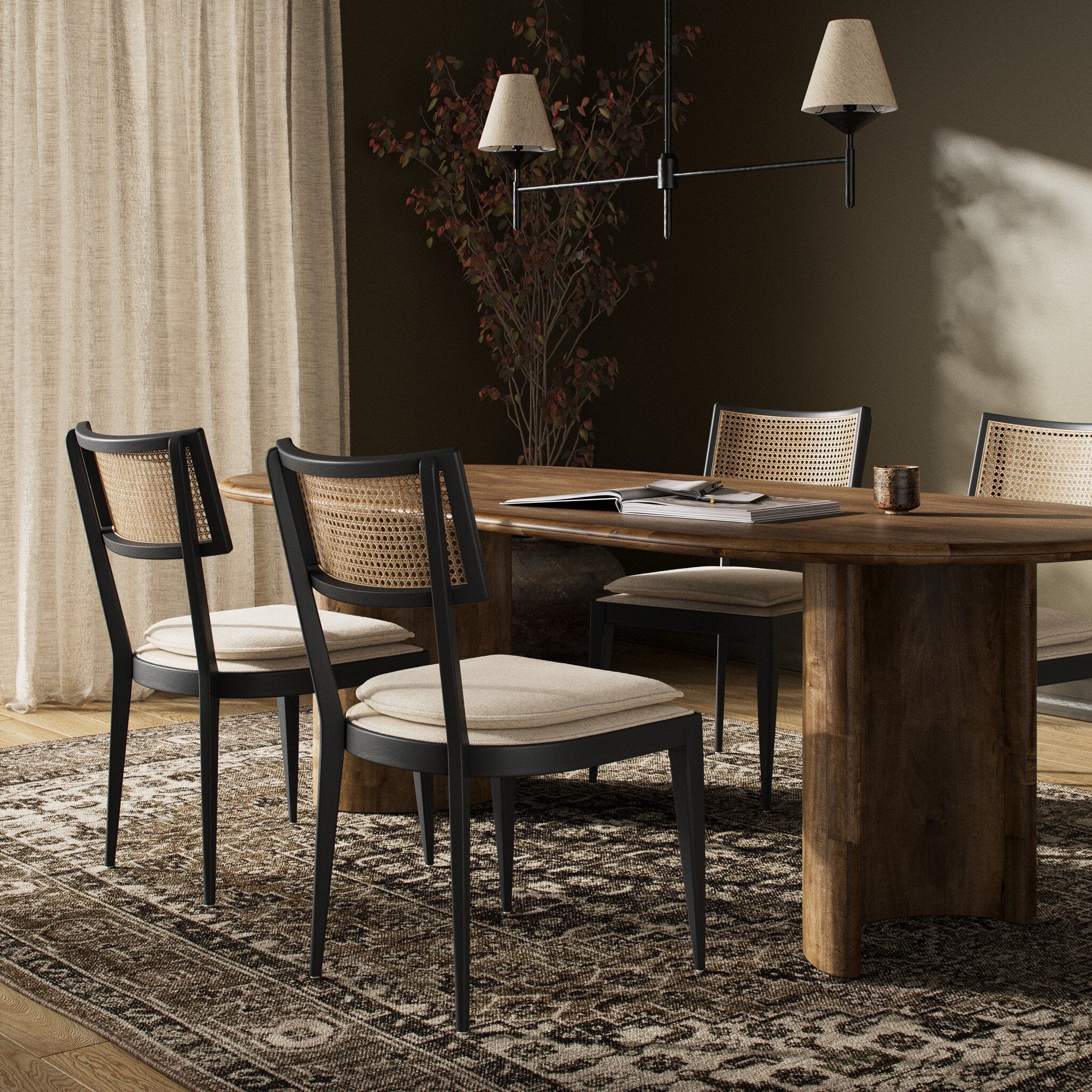 Dining scene Britt Dining Chair in Cambric Ivory performance fabric with black parawood tapered legs