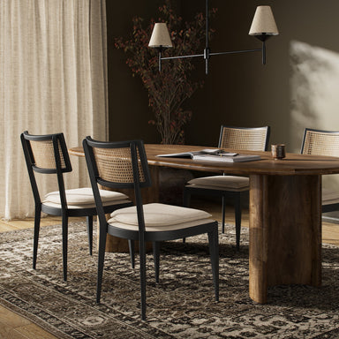 Dining scene Britt Dining Chair in Cambric Ivory performance fabric with black parawood tapered legs