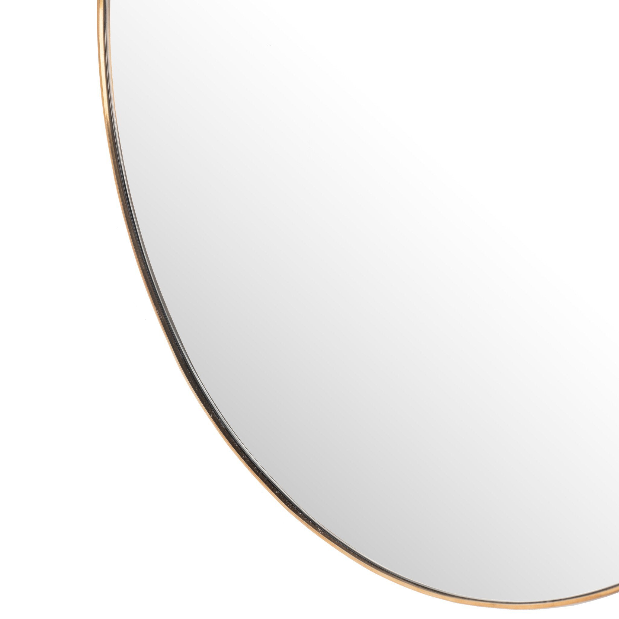Sleek edge close-up of the Georgina mirror's slender polished brass frame showing the refined modern edge and spacious mirror finish
