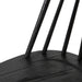 Close-up of dark wood chair seat with slat bases and vertical back supports, black finish