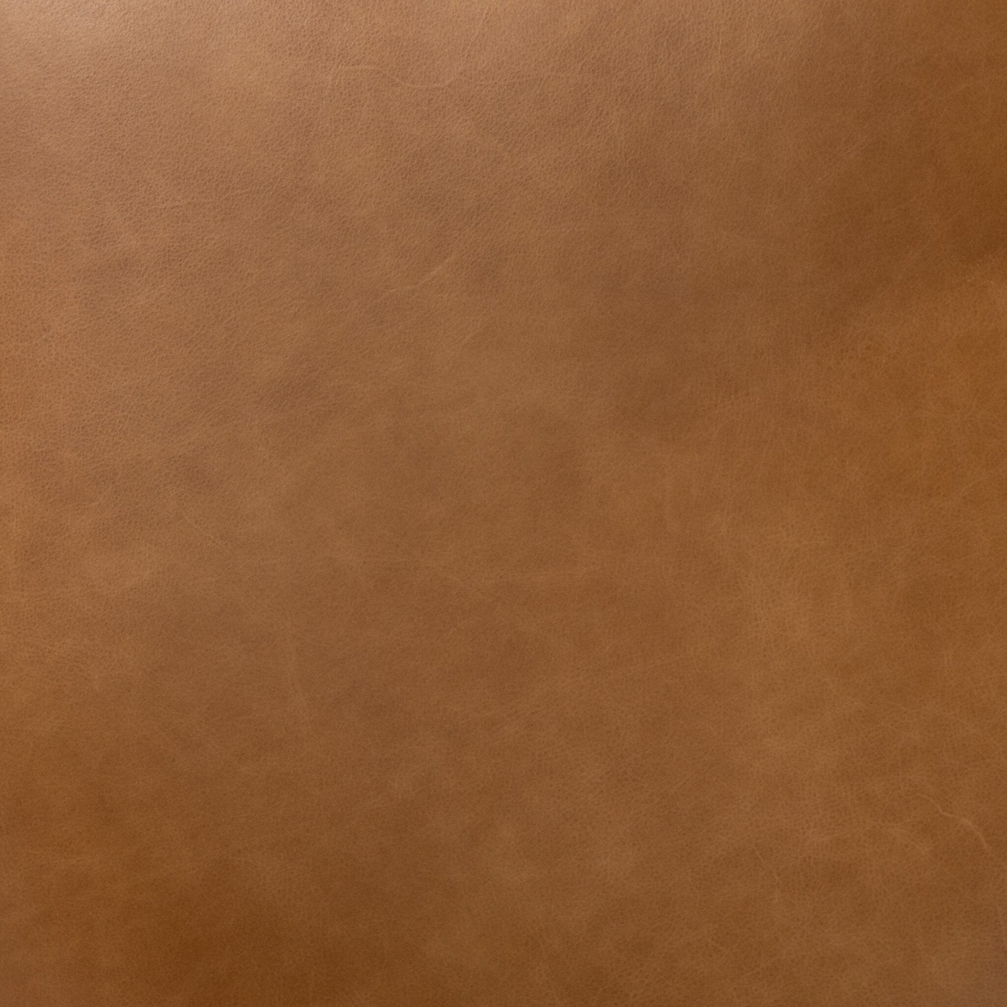 Tan faux leather upholstery panel with fine grain texture