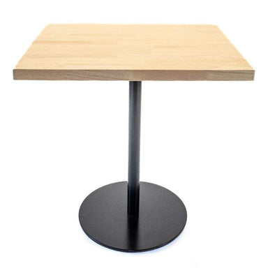 Square table with wooden top and black round base on a white background