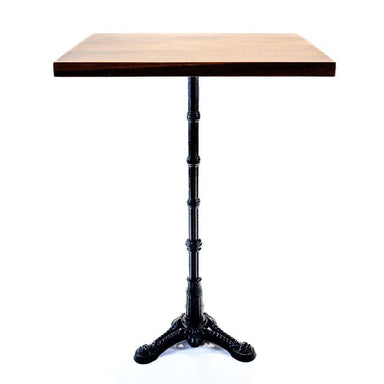 Square wooden table with black metal decorative legs on a white background