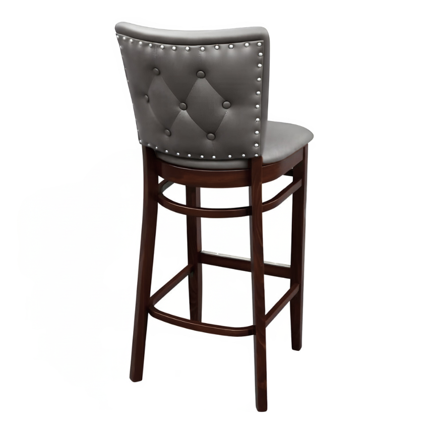 Stone Grey Dame Quincy Bar Stool with a tufted upholstered backrest, padded seat, and dark wood frame with a built-in footrest