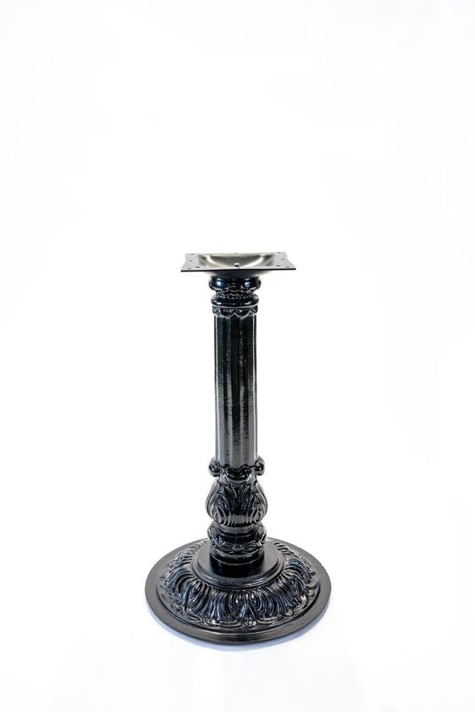 Black cast table base with round pedestal, decorative scroll details, and top mount plate