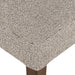 Armless dining chair seat cushion close-up in beige textured woven upholstery