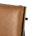 Crete bar stool close-up of tan backrest and side hardware on wood frame