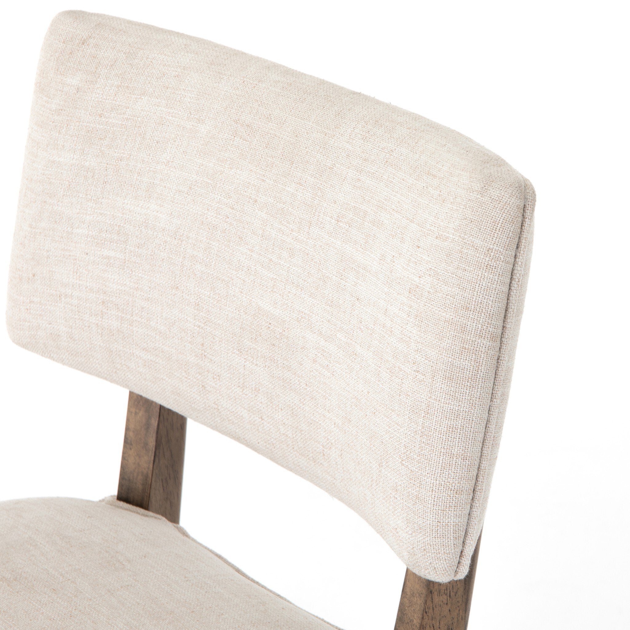 Top cushion detail Orville Dining Chair in Cambric Ivory performance fabric with natural parawood legs