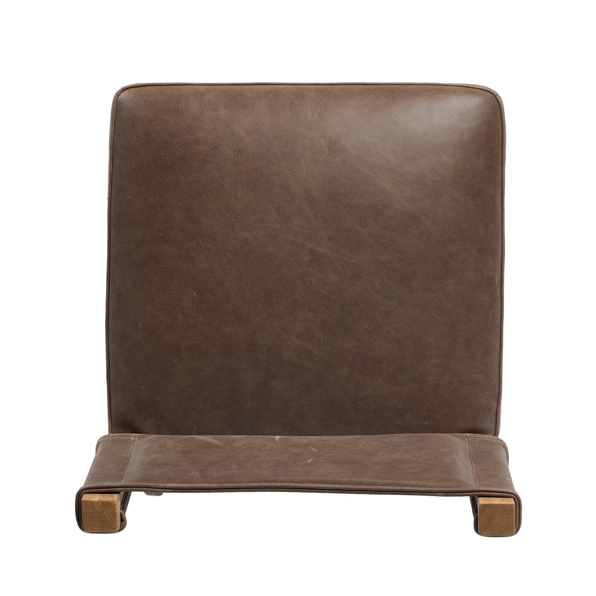 Armless dining chair with tall brown upholstered back and matching seat