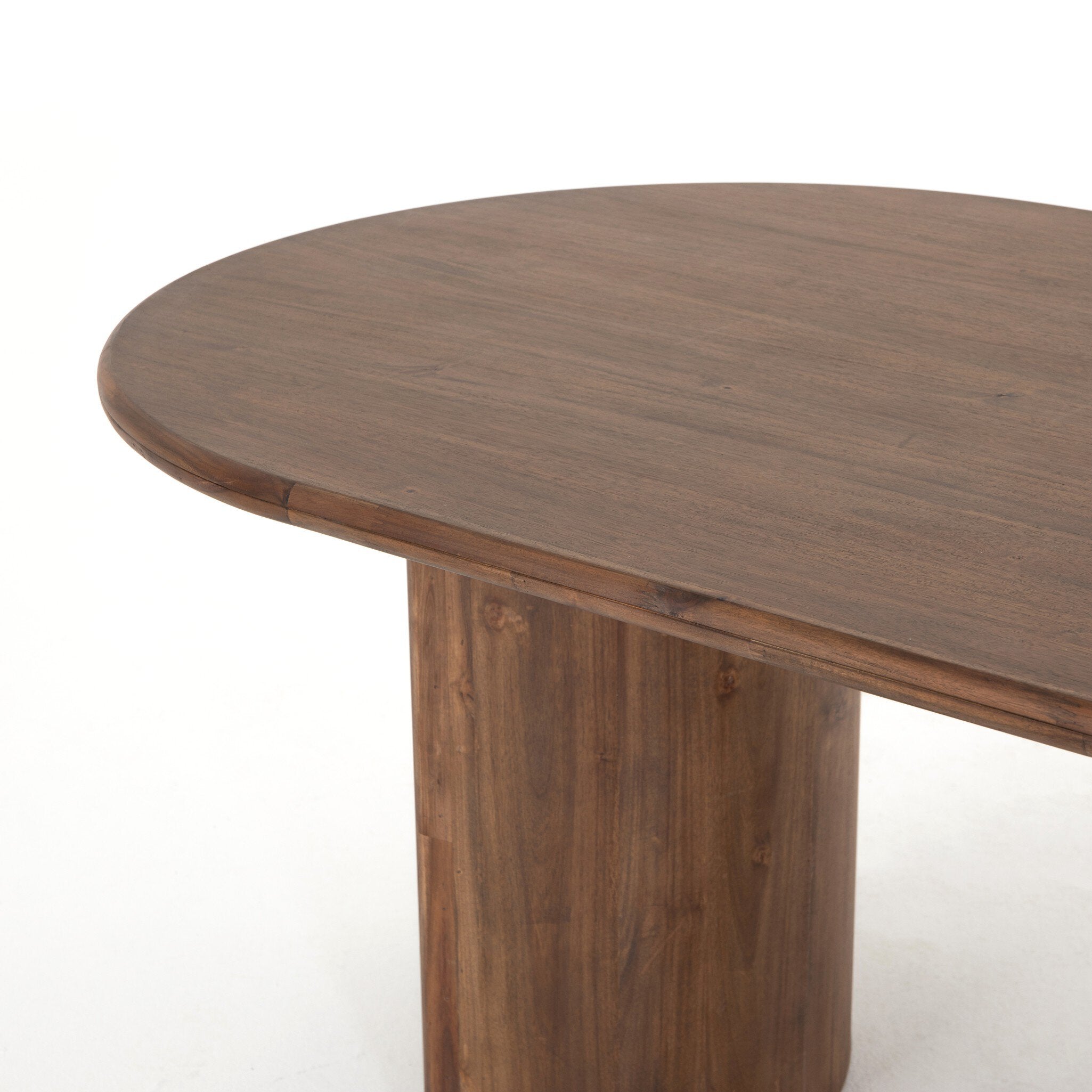 Top view Paden Dining Table in Seasoned Brown Acacia with crescent-shaped legs and an oval tabletop