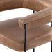 Close-up of tan cushioned seat and back support, showing seam lines and black frame