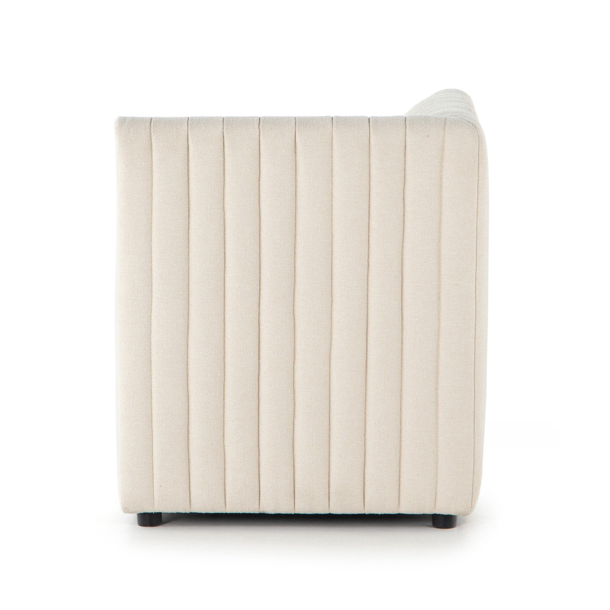 Side Custom Augustine dining banquette in neutral performance fabric with high-back tufted detailing and wood base.